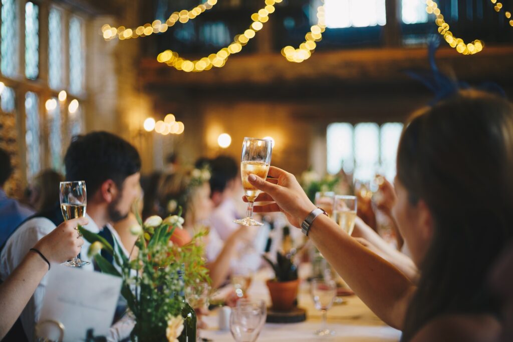 People raising a glass during a party