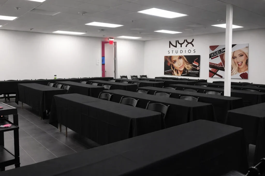 Corporate event setup with black table linens and classroom-style seating for business training in Long Beach CA