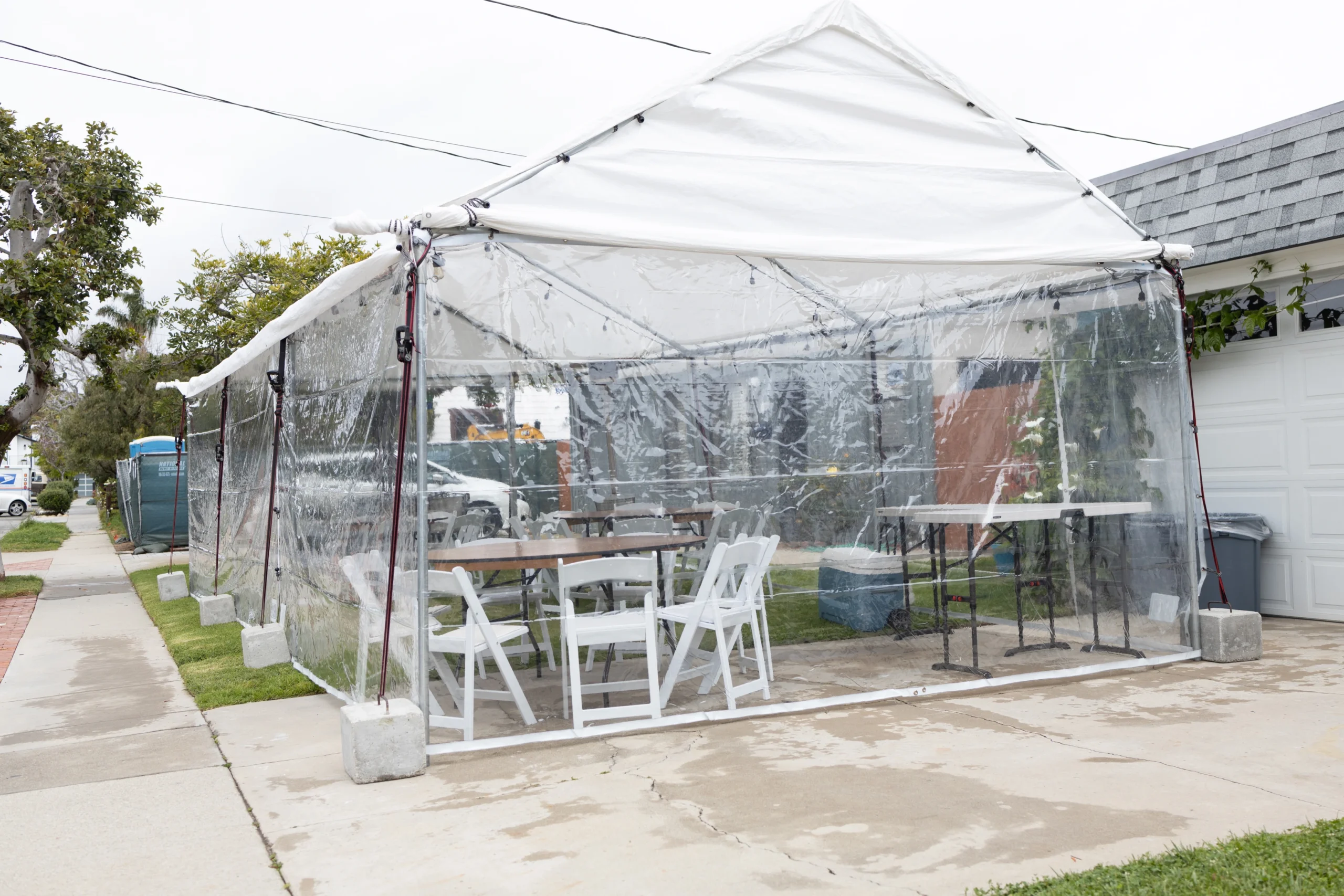03.30.24-setup residential-tent, clear walls, table, chair (2)